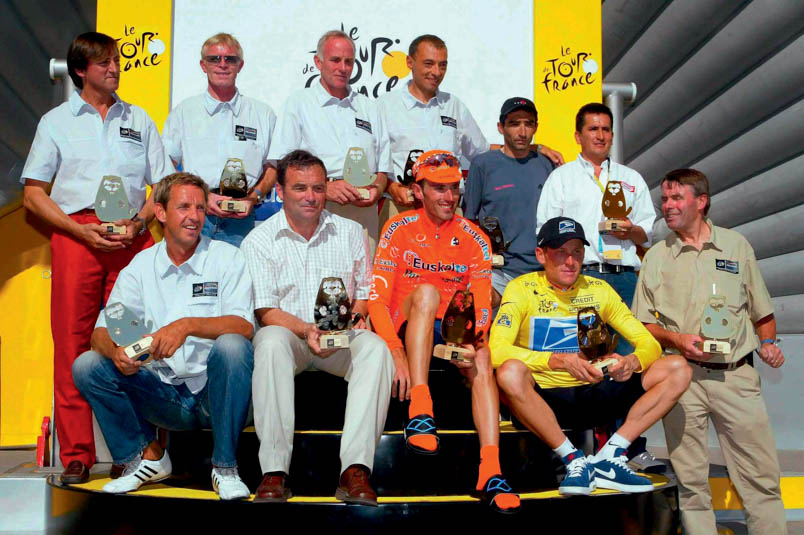 In the Tour de France of 2003, many winners of a Tour stage to the top of Alpe d’Huez are honored. Standing from left to right: Faustino Coppi (son of and therefore stand-in for Fausto Coppi, the first winner in 1952), Peter Winnen (1981, 1983), Joop Zoetemelk (1976, 1979), Roberto Conti (1994), Giuseppe Guerini (1999), Lucho Herrera (1984), and Hennie Kuiper (1977, 1978). Sitting from left to right: Steven Rooks (1988), Bernard Hinault (1986), Iban Mayo (2003), and Lance Armstrong (2001)