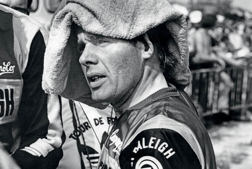 With a towel from Ruud Bakker, Hennie Kuiper wipes off the sweat of his brow after a tough mountain stage.