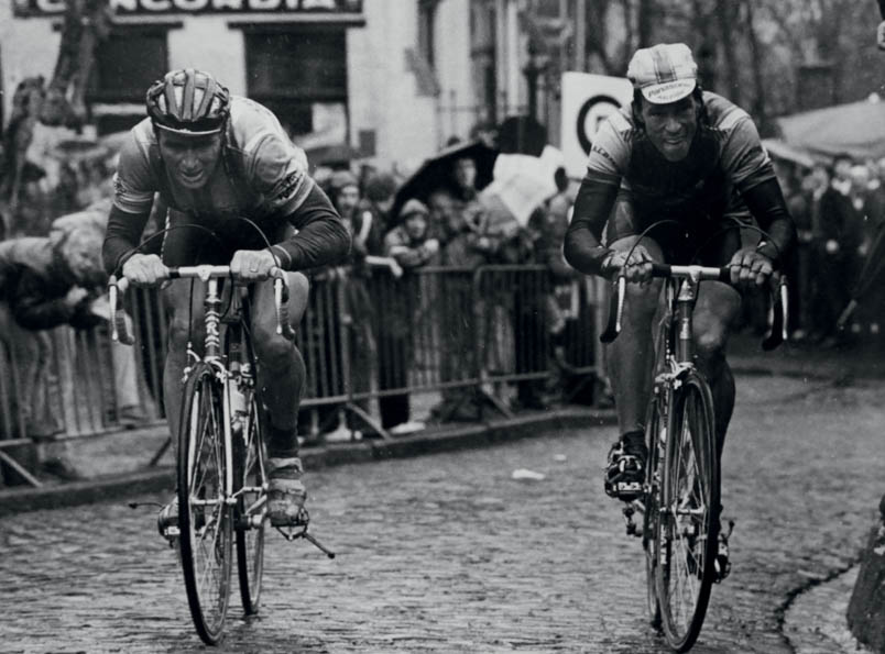 The moment when Hennie Kuiper loses the Tour of Flanders 1985 on the Muur van Geraardsbergen in 1985. It is clearly visible that the toe clip is not around but under his left shoe. Kuiper loses control over the pedals. Phil Anderson will benefit