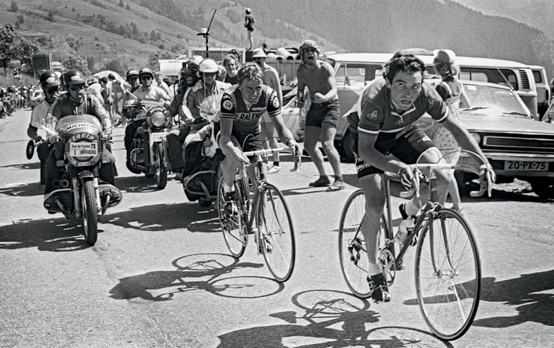 Bernard Hinault casts an almost fearful glance towards the village of Alpe d’Huez and assesses the distance to the lone escapee Michel Pollentier. Hennie Kuiper waits a little longer with his attack.