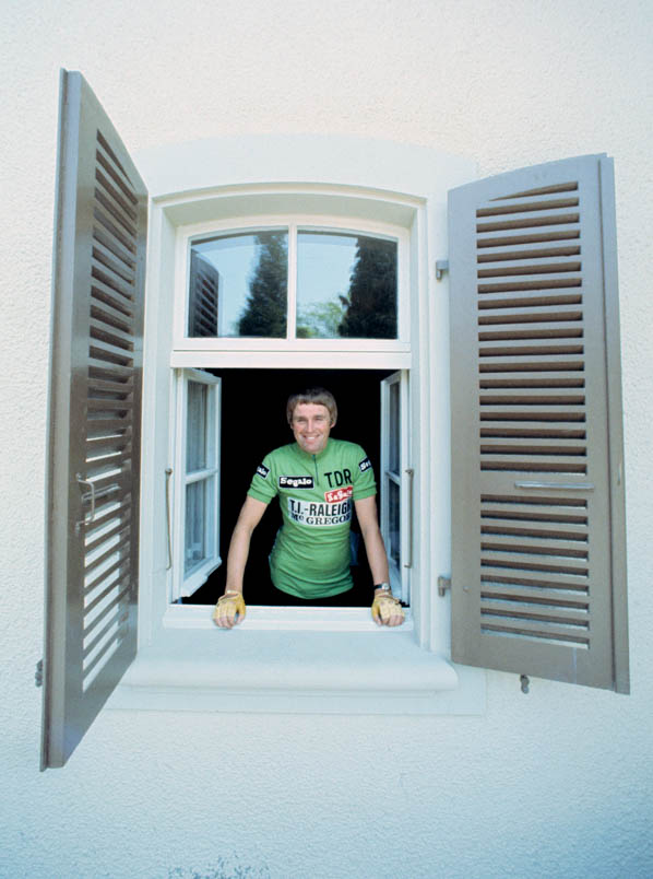 Shining, Hennie Kuiper poses in the green jersey of the Tour de Romandie, which is prominently displaying large TDR initials on his left chest.