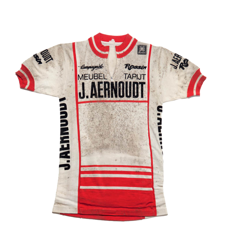 1983 - **THE AERNOUDT JERSEY** IN WHICH HENNIE KUIPER ACHIEVES HIS LEGENDARY PARIS-ROUBAIX VICTORY. THE MUD-SPLATTERED JERSEYS TELL THE STORY OF THE HARDSHIPS